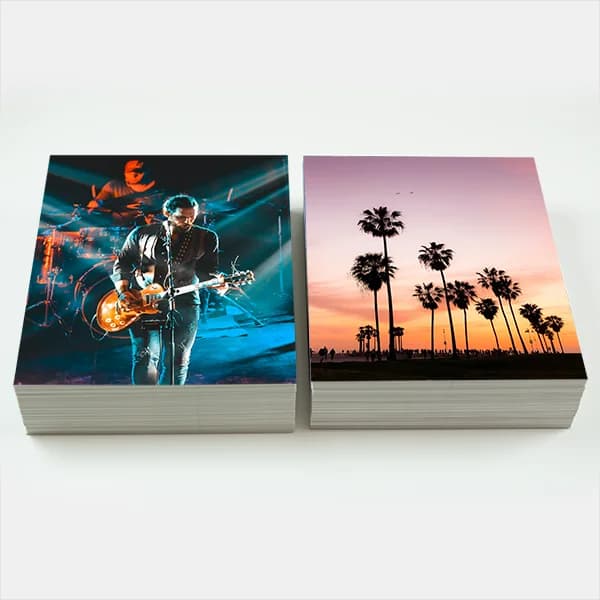 Image of 2 stacks of 8x10 prints next to each other